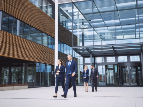 Man walking outside tall building possibly in Mexico.